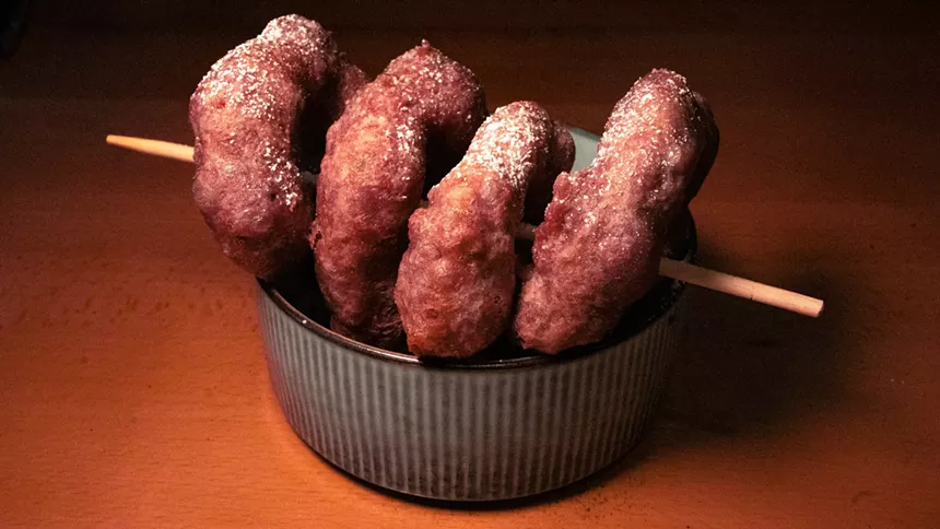 fried doughnuts on a stick