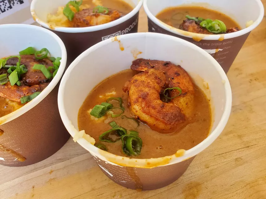 a cup of shrimp and grits