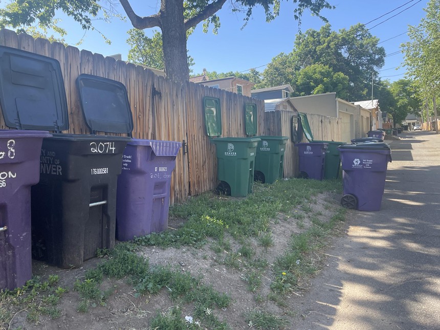 Denver trash, recycle and compost bins open in alleyway