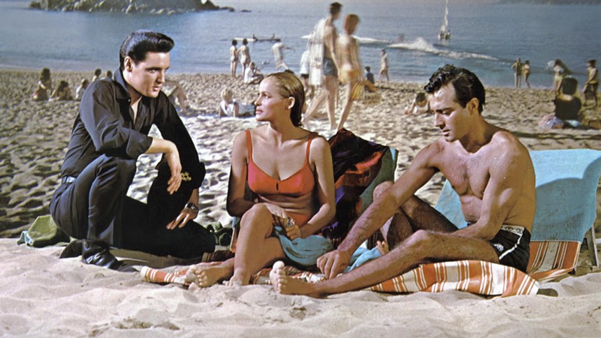 Elvis on the beach with woman and man