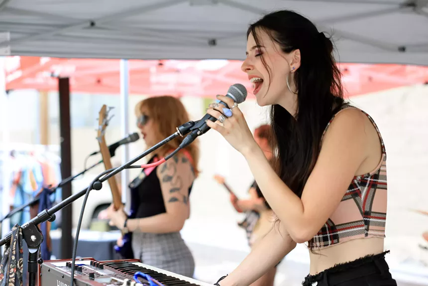 Denver band May Be Fern performs a concert in the parking lot of Westword