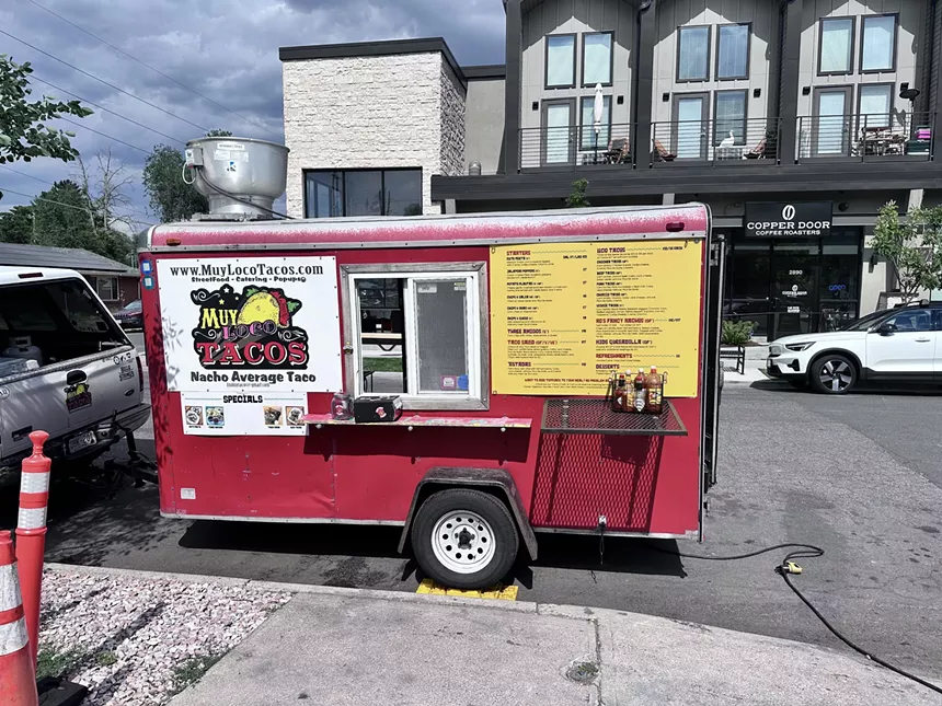 a small red food trailer