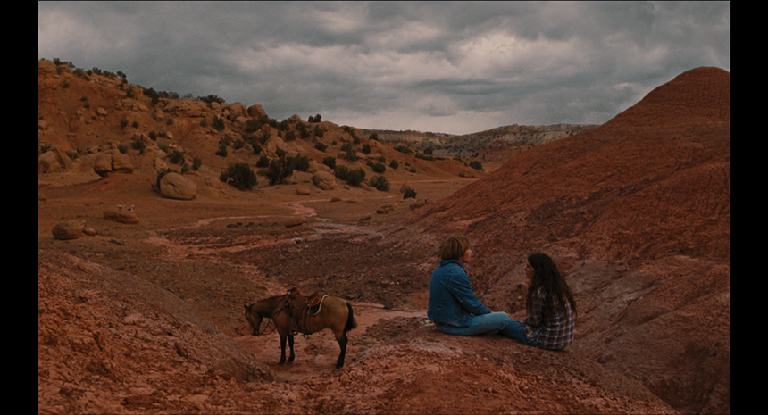 two people and horse in canyon