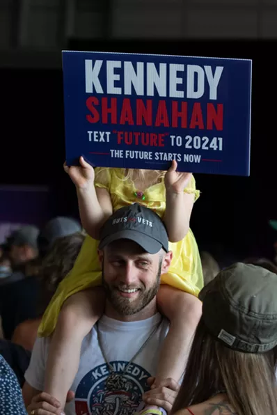 Girl holds RFK Sign