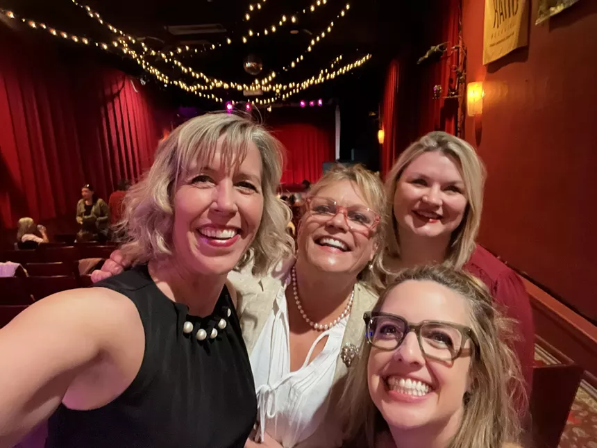 women taking a selfie and smiling