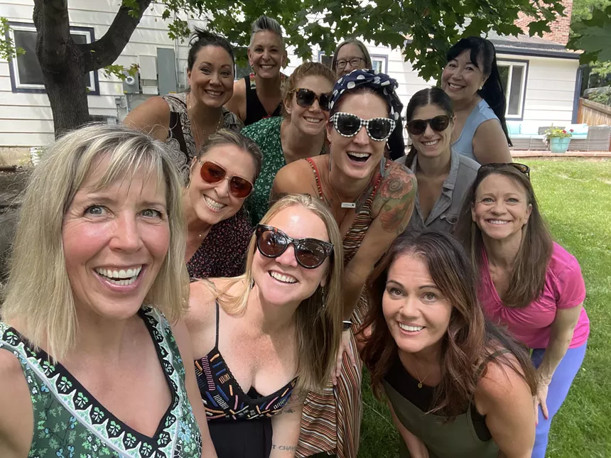 women taking a selfie and smiling