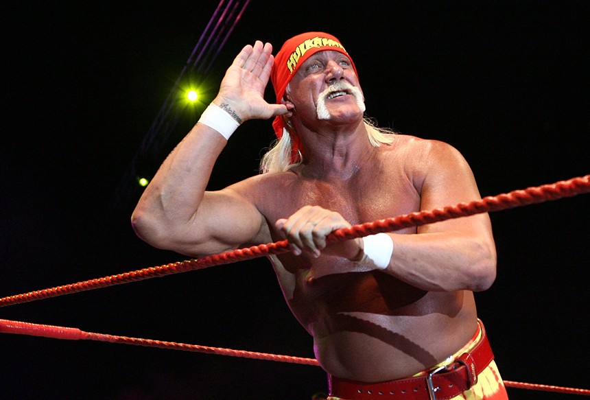 shirtless wrestler with a white mustache
