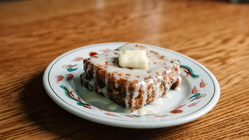 a slice of french toast with white sauce on top