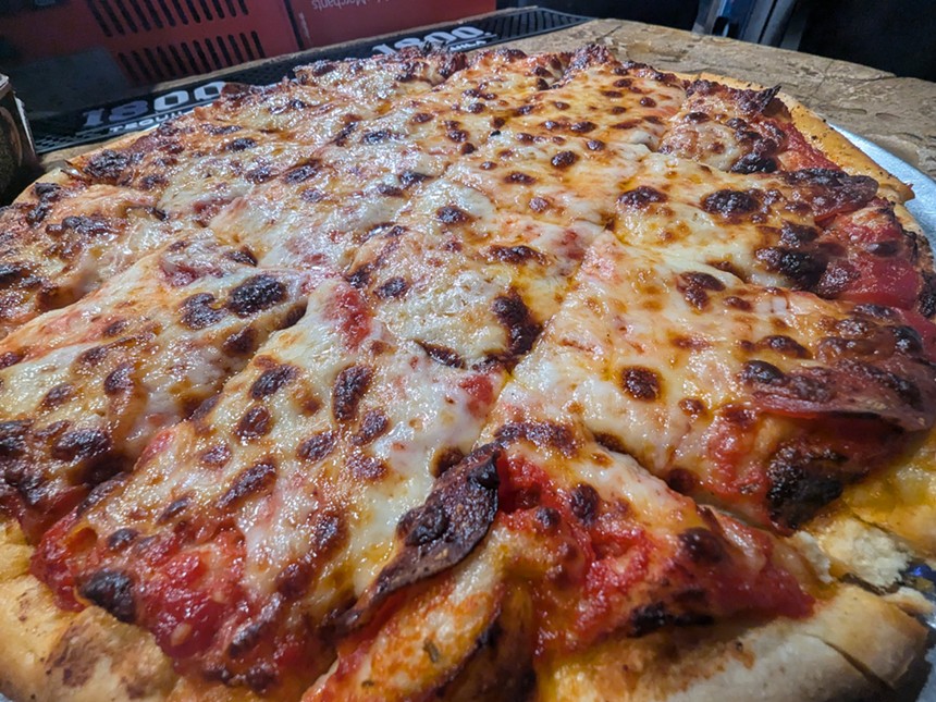 A pizza pie.