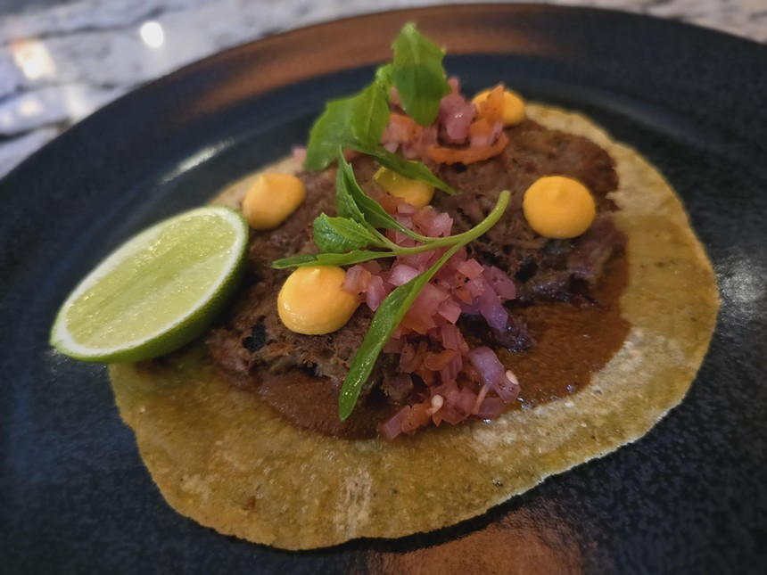 a taco with pickled onions