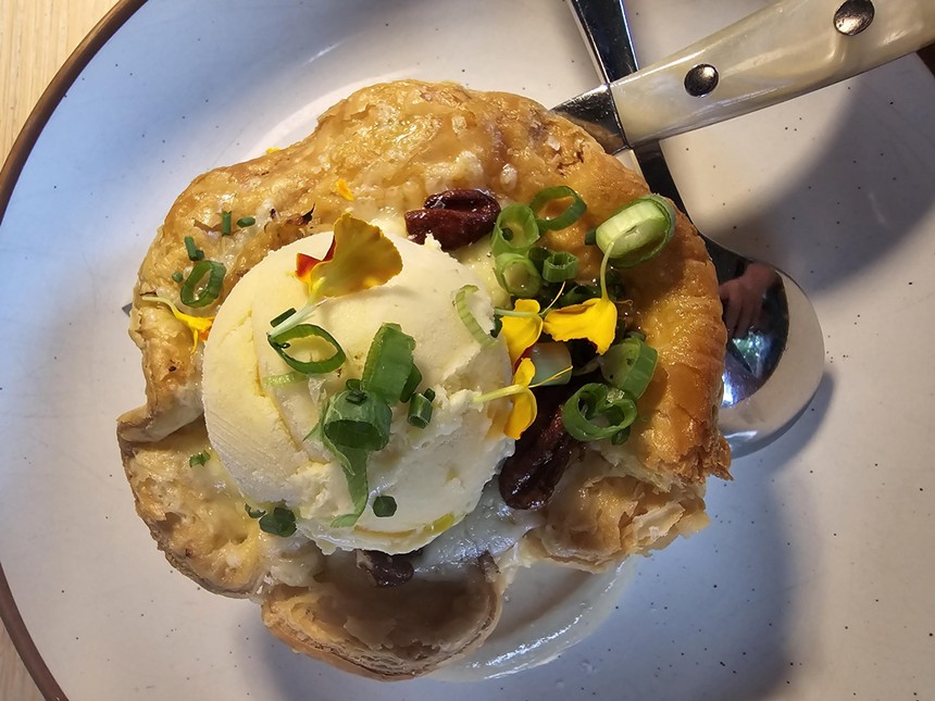 a pot pie topped with a scoop of ice cream