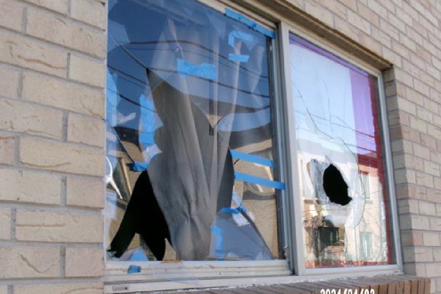 A window is broken at an apartment.