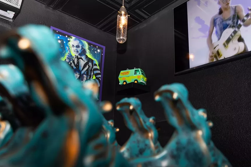 black walls with various '80s decor