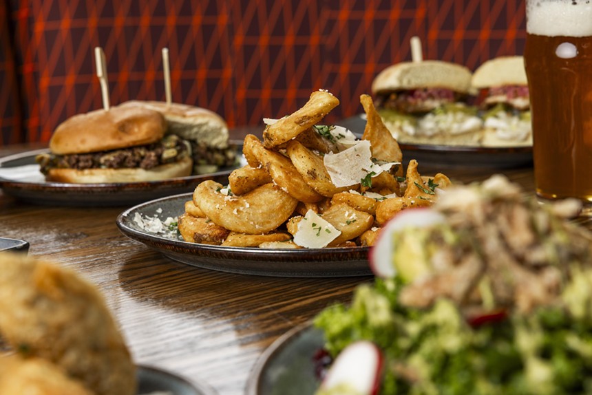 fries on a table with other dishes