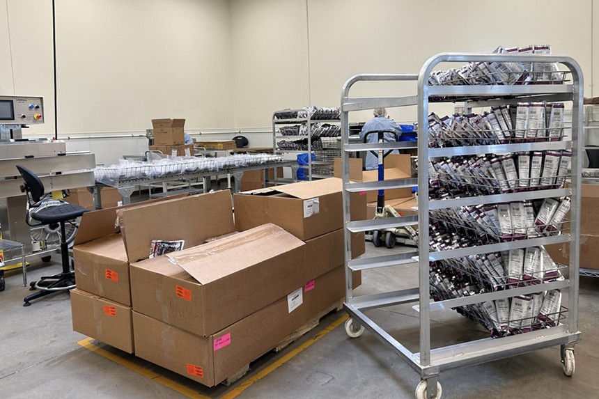 A rack and boxes of Astronaut Foods ice cream sandwiches at its Boulder facility