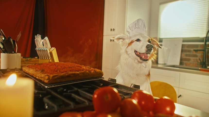 dog chef next to her tomato pie