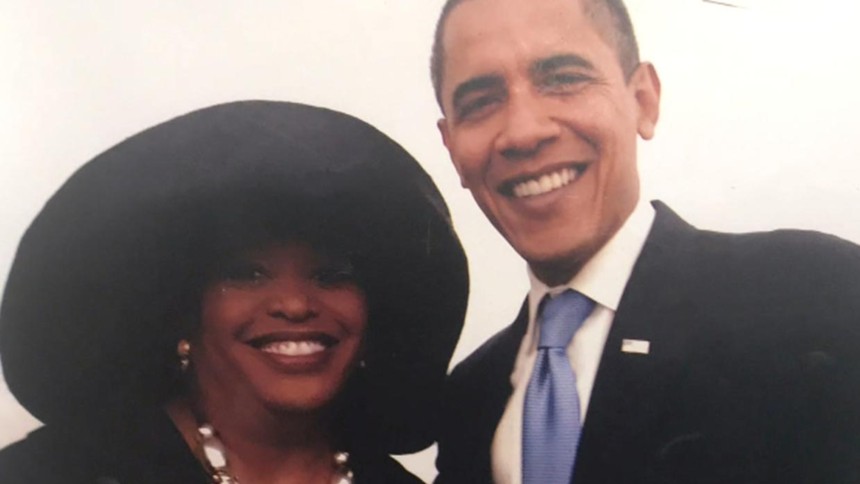 woman in hat with obama