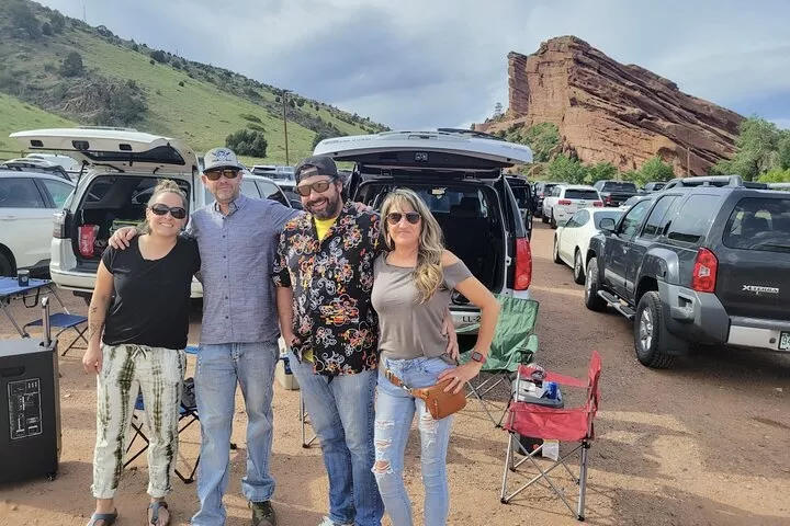 A group of people posed at a Red Rocks tailgating party