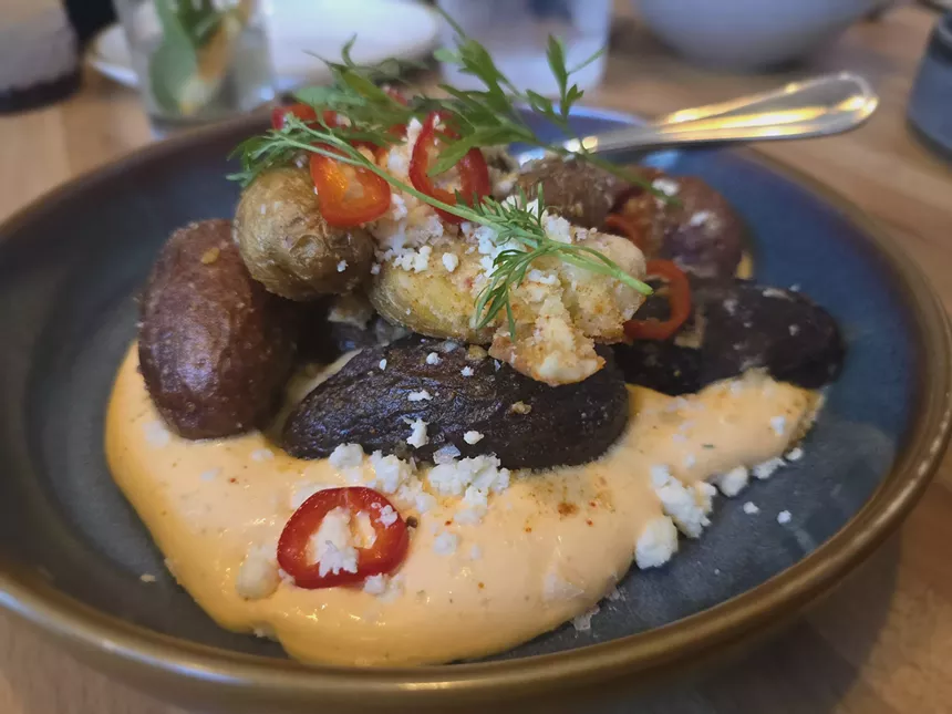 potatoes over a sauce