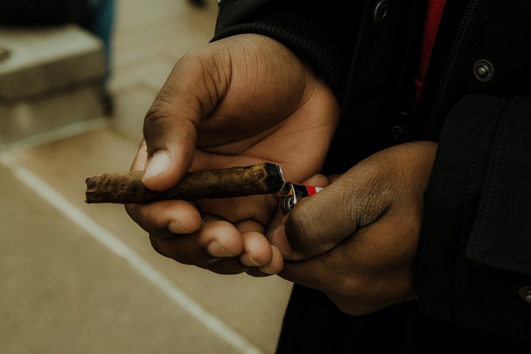 Man lights marijuana blunt