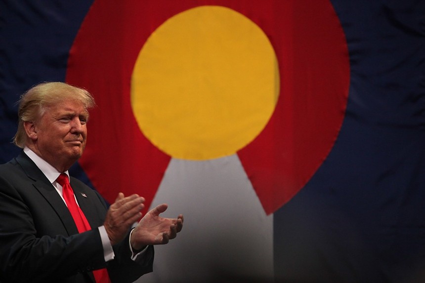 donald trump in front of Colorado flag