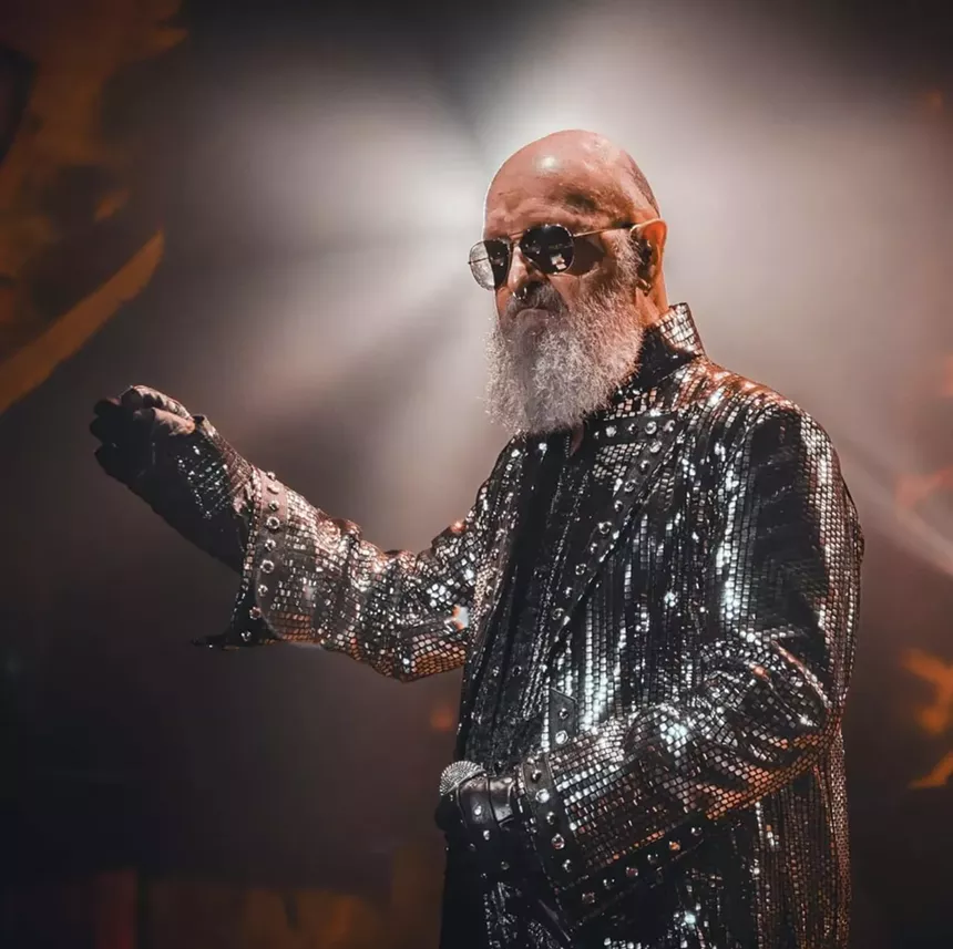 lead singer of judas priest, rob halford, in a studded leather jacket