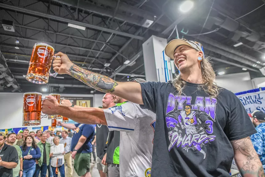 people holding steins