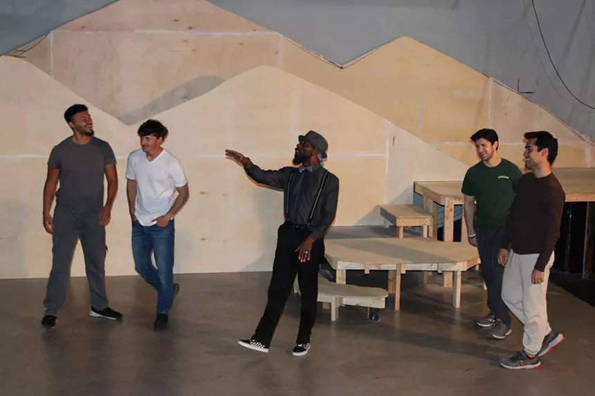 actors on set rehearsing Cannibal: The Musical