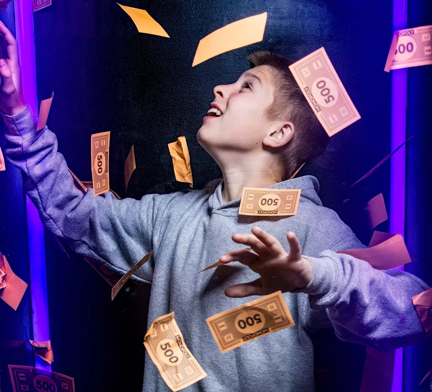 boy with monopoly money
