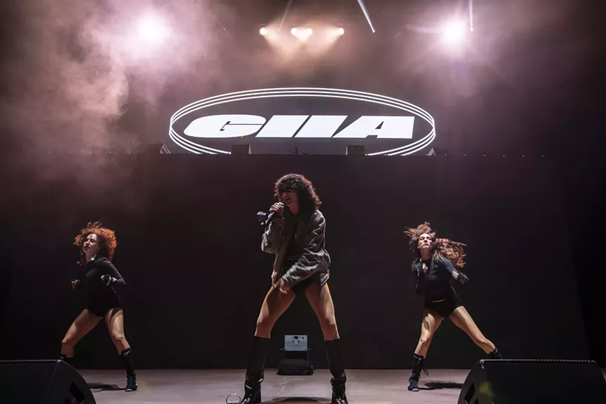 A photo showing Evan Giia with dancers during her performance at Red Rocks.