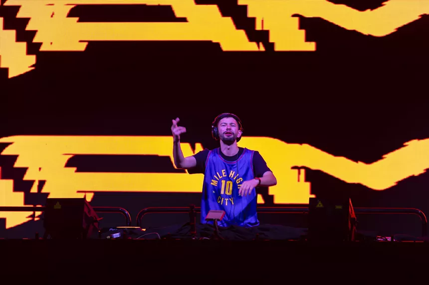 A photo showing Hamdi gesturing to the crowd.