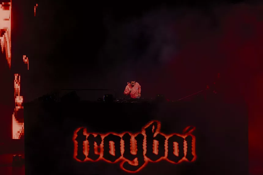 A photo showing Troyboi performing at Red Rocks with his name showing in his stage design.