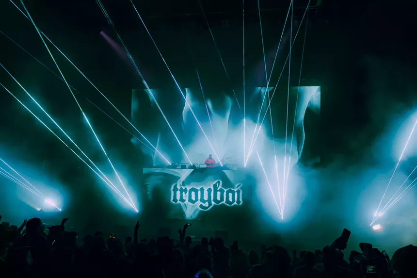 A photo showing the production lights and lasers during Troyboi's set at Red Rocks.