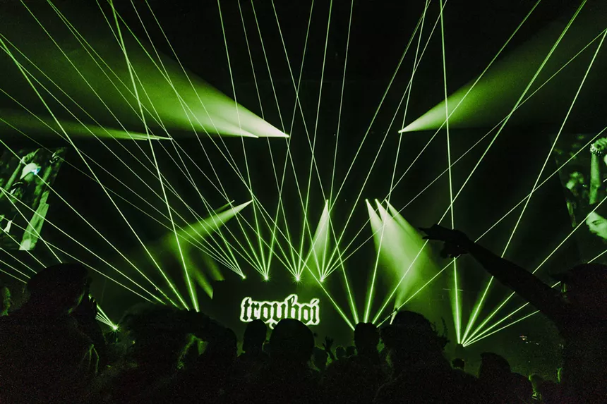 A photo showing the production lights and lasers during Troyboi's set at Red Rocks.