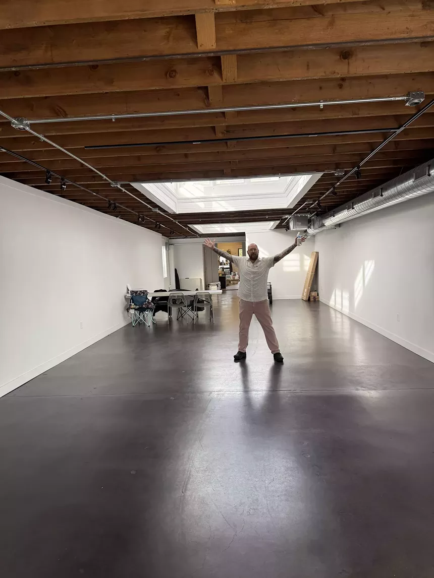 man in a large empty room