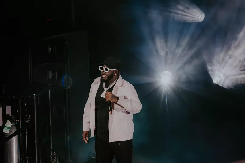 A photo of T-Pain on stage performing at Red Rocks in Morrison, Colorado.