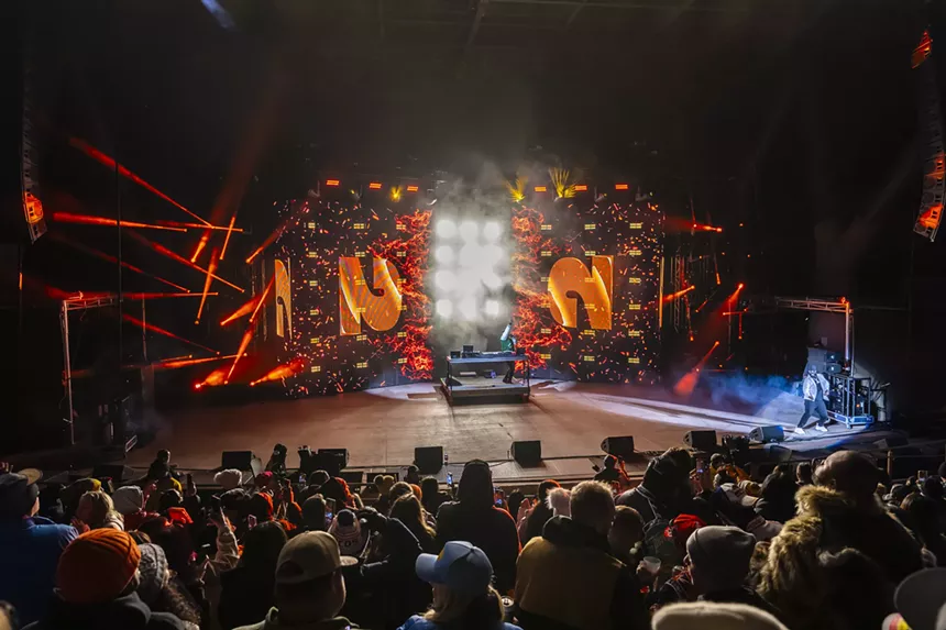 A photo showing the Red Rocks crowd during T-Pain's healdining performance.