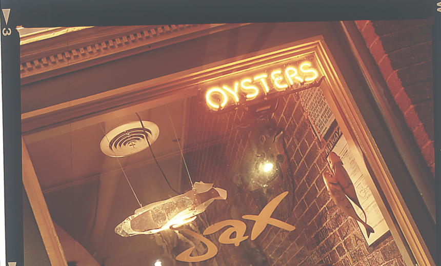 neon "oysters" sign in a window