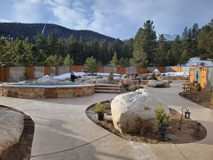 Concrete walkways and outdoor pools at Charlotte Hot Springs