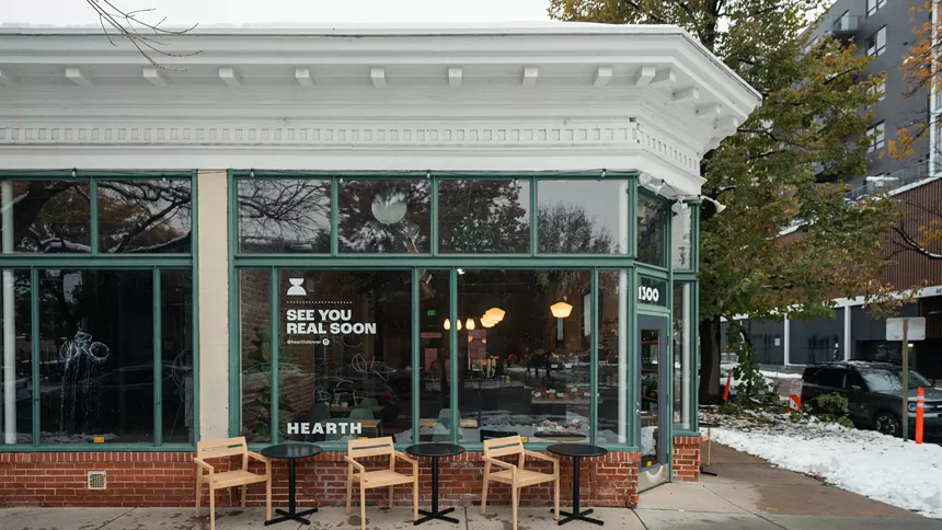 exterior of a building with chairs and tables out front
