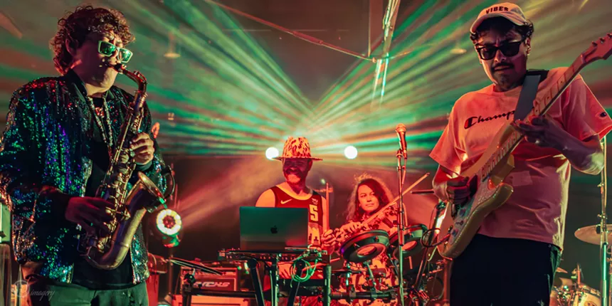 person playing drums on stage.