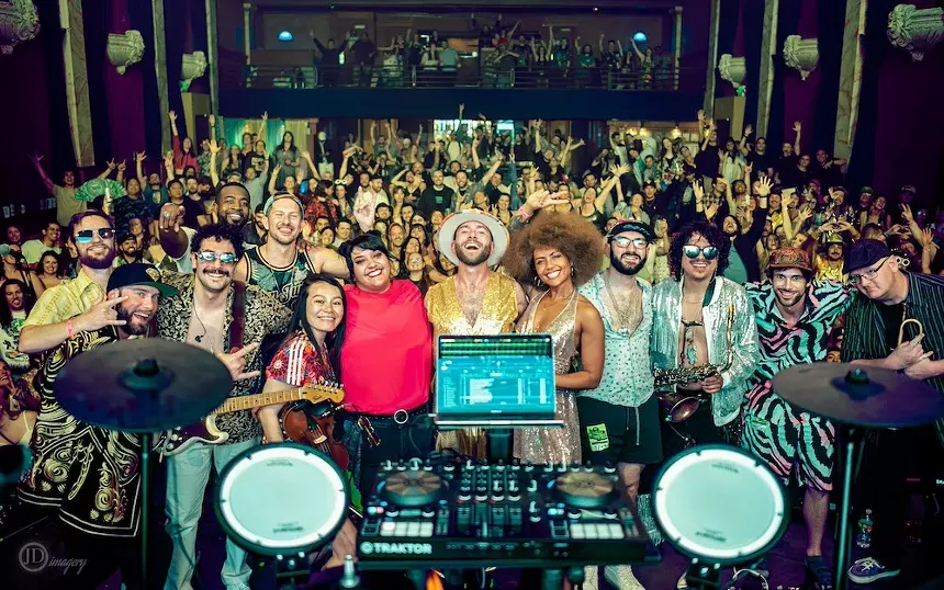 Room filled with musicians and fans.