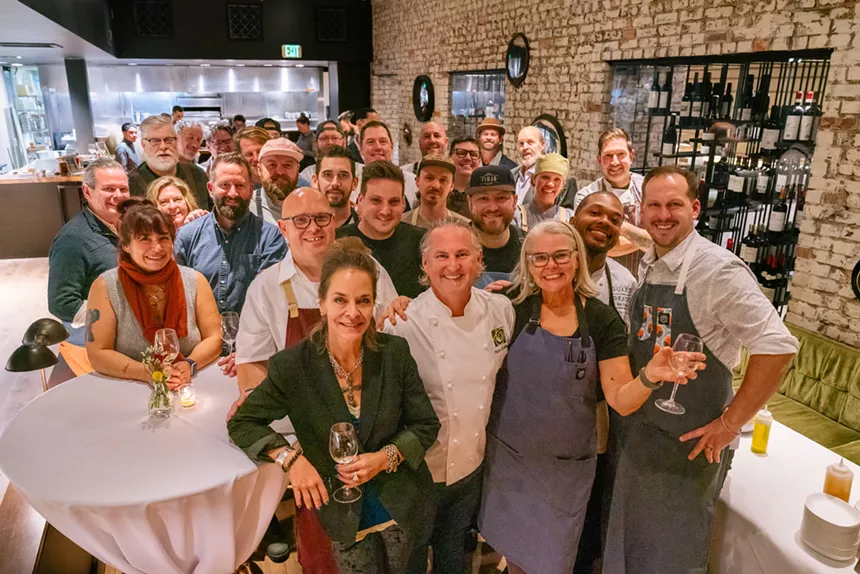 group of restaurant workers celebrating.