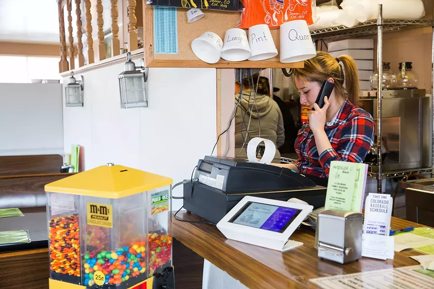 person working behind the counter at a restaurant