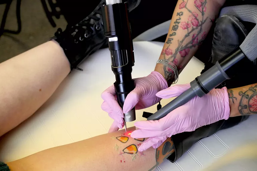A person gets a tattoo