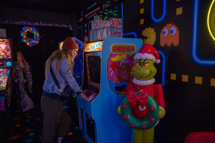 person playing an arcade game
