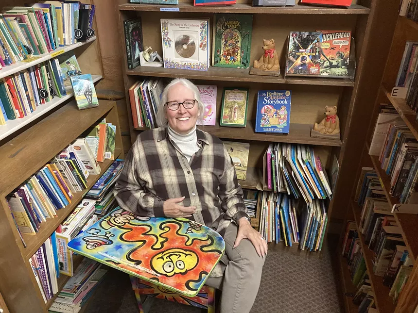 Holly Brooks sitting in Capitol Hill Books