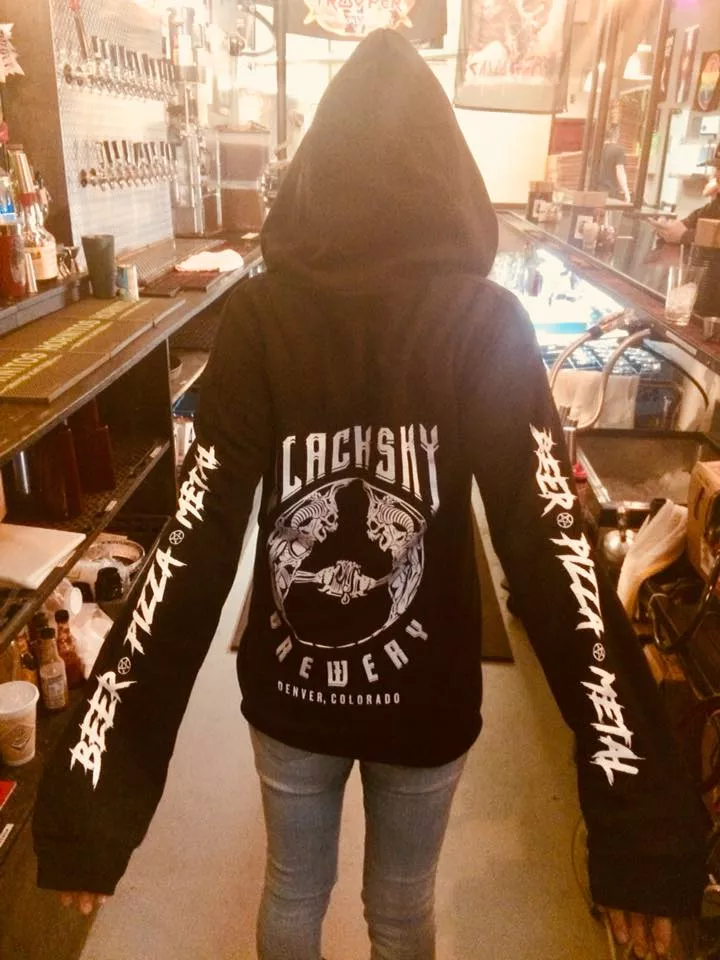 Person in a black metal hoodie.
