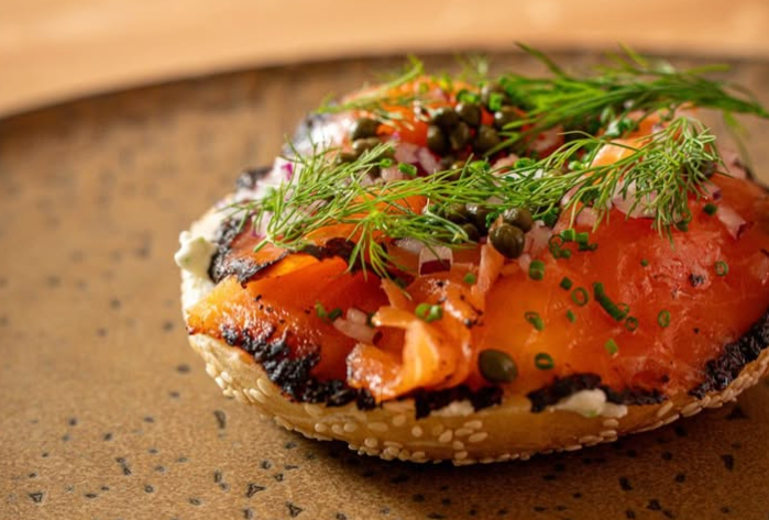 bagel topped with lox and dill
