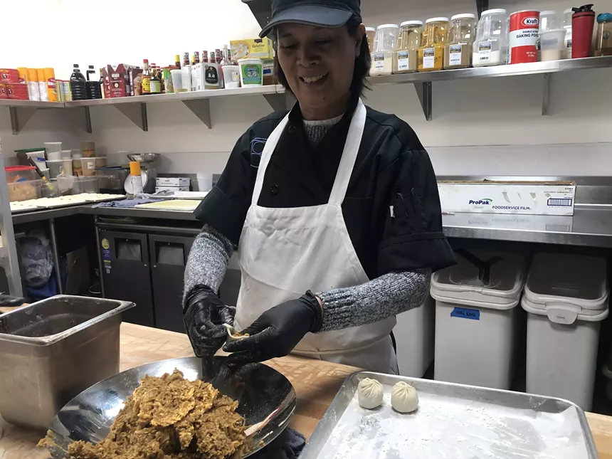 woman filling dumplings
